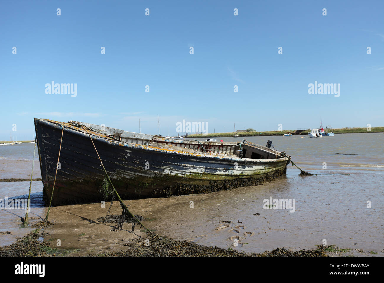 Old abandoned wooden boat on the river Ore, near Orford Quay, Suffolk Stock Photo