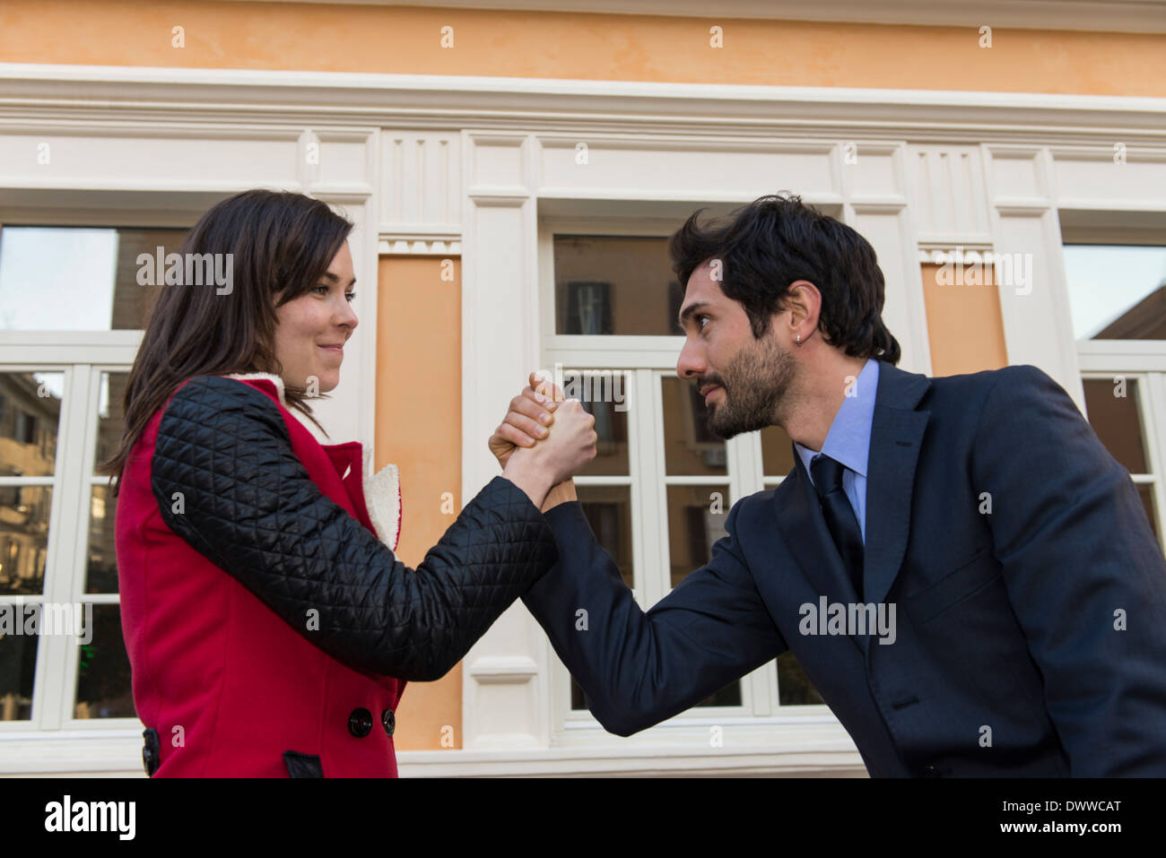 Woman and man arm wrestling for fun Stock Photo Alamy