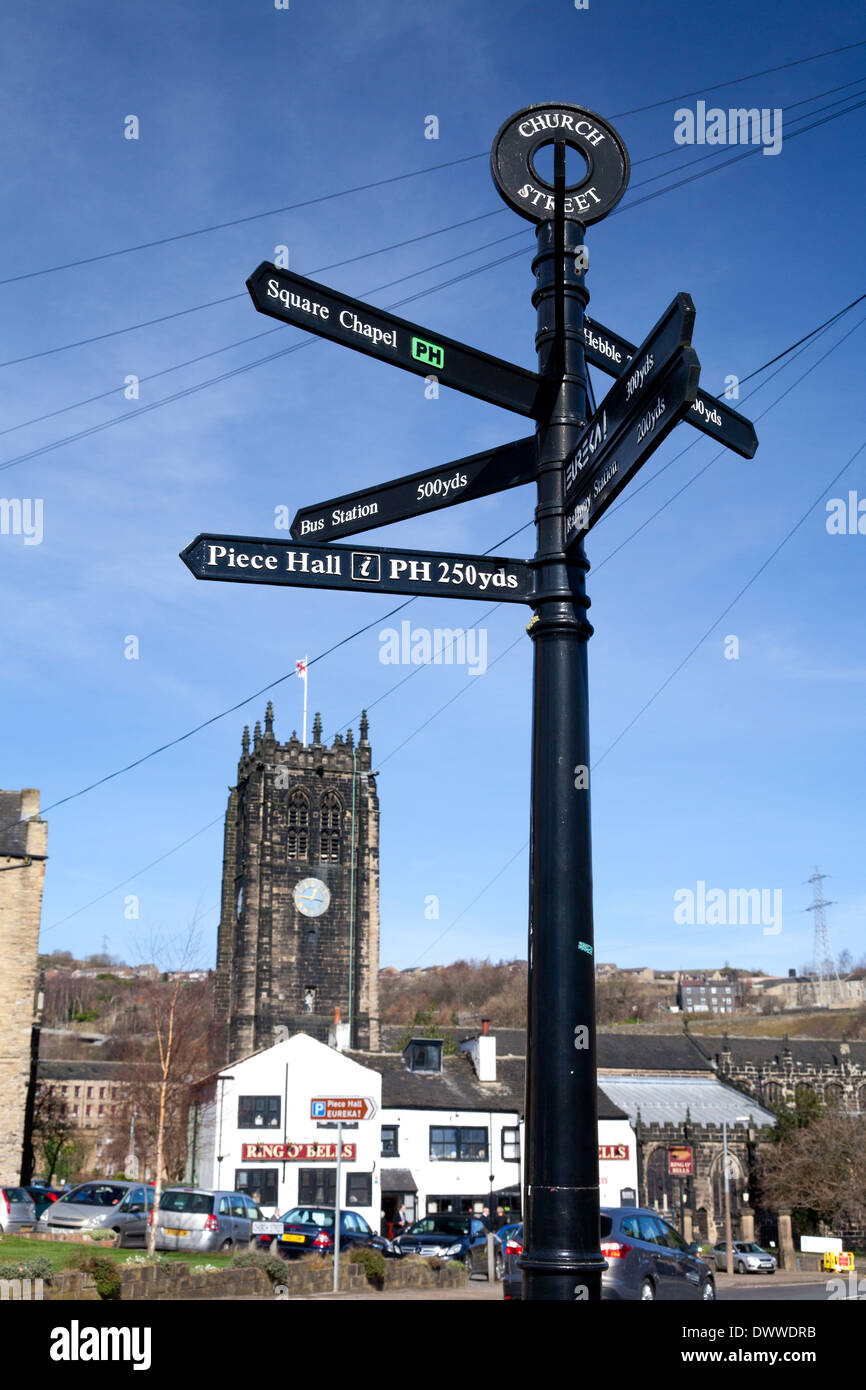 Tourist signpost with the Minster in the background, Halifax, West Yorkshire Stock Photo