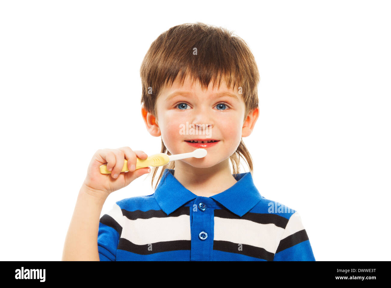 Close shoot of cute little three years old boy brushing his teeth