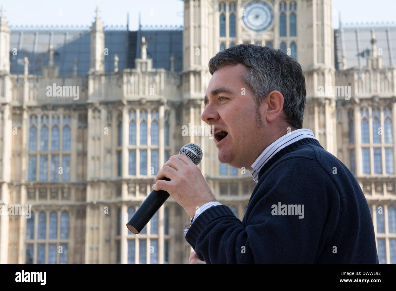 London, UK. 13th Mar, 2014.  Dominic Dyer of the Badger Trust speaks as protesters gather outside Westminster while a parliamentary debate on the controversial badger cull takes place inside the house of commons. Badgers have been linked to the spread of bovine tuberculosis in cattle and experimental culls of badgers were carried out in 2013 in an attempt to stop the spread of the disease. Anti-cull protestors have claimed that the cull is inefficient, inhumane and scientifically flawed. Credit:  Patricia Phillips/Alamy Live News Stock Photo