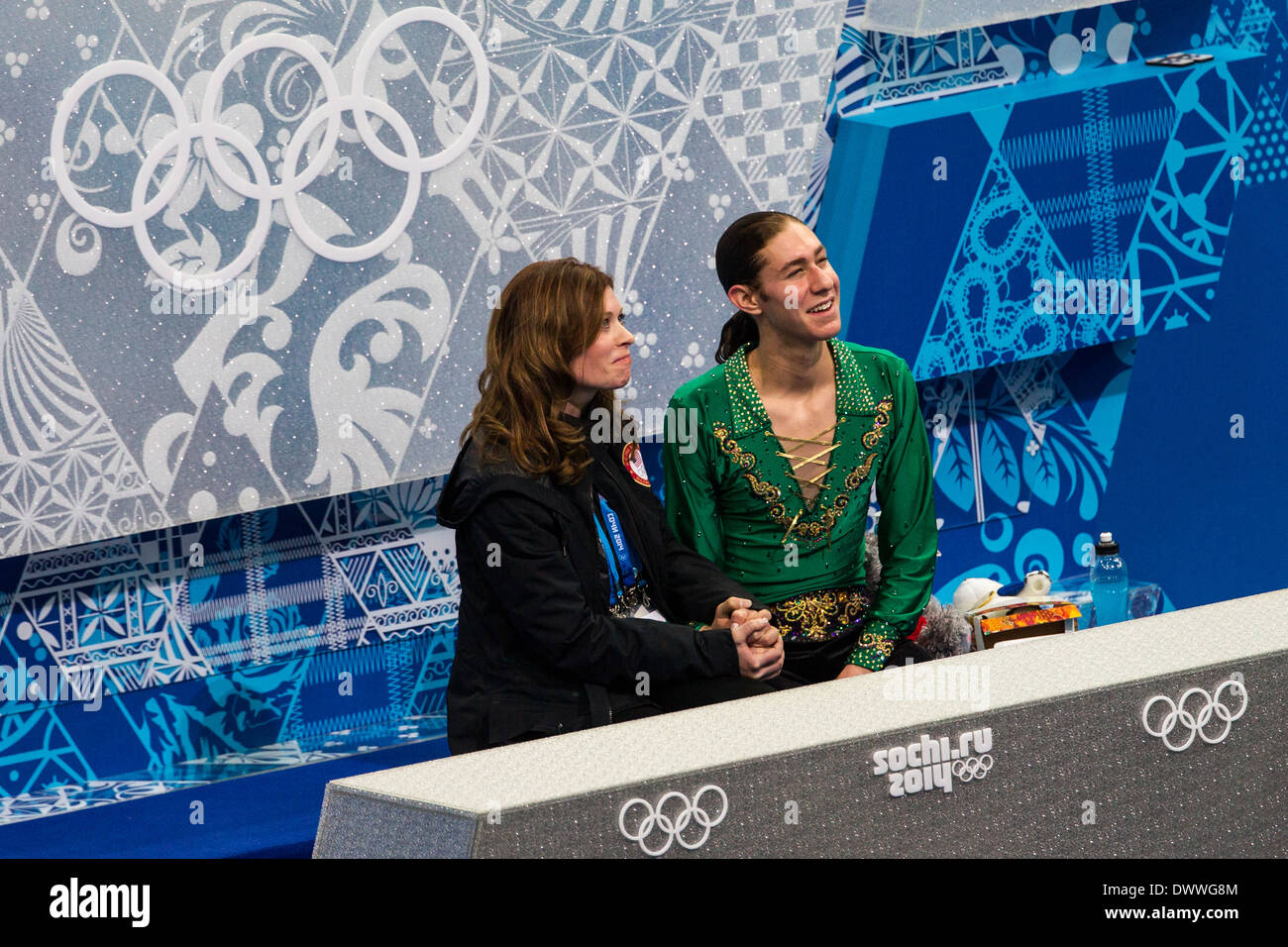 Jason Brown (USA) in the kiss and cry with coach Kori Ade after the Men