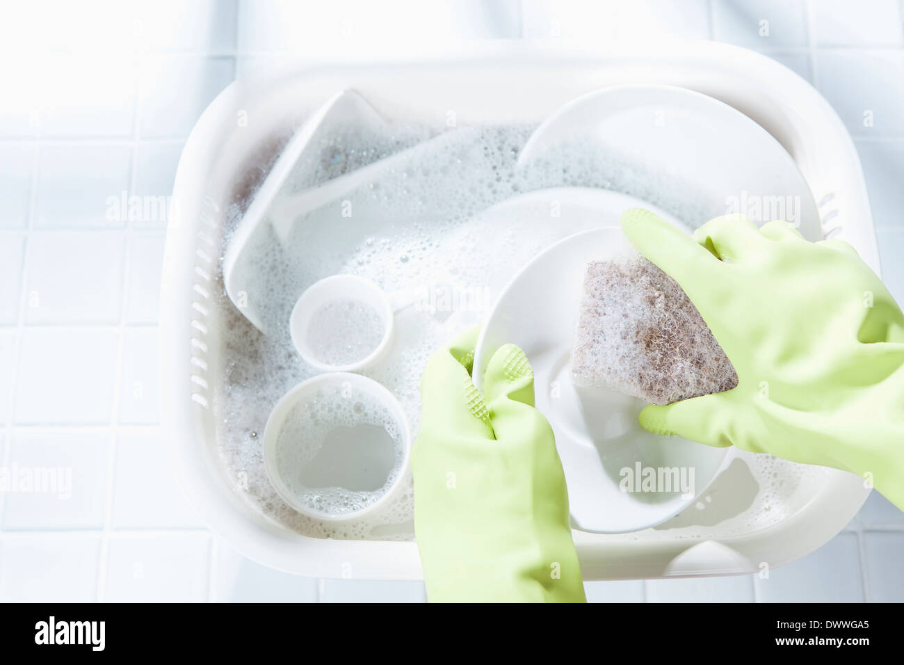 several dishes in the sink with foam Stock Photo Alamy