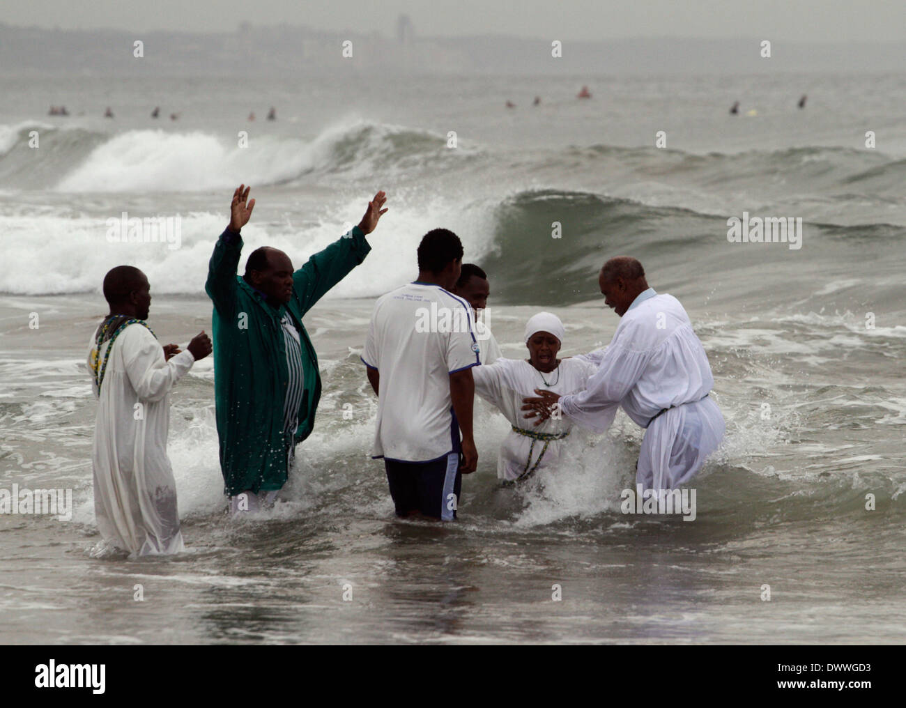 A woman is baptised in the Indian Ocean on the Durban beach front, March 28, 2010. © Rogan Ward 2010 Stock Photo
