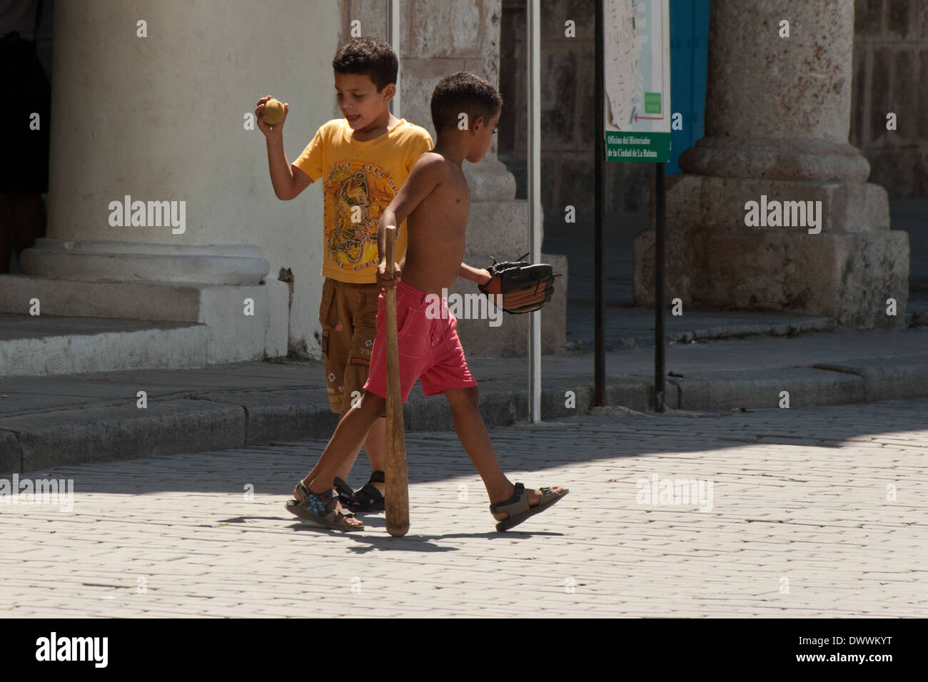 Boys playing baseball in Plaza Vieja in Habana Vieja, Havana, Cuba Stock Photo