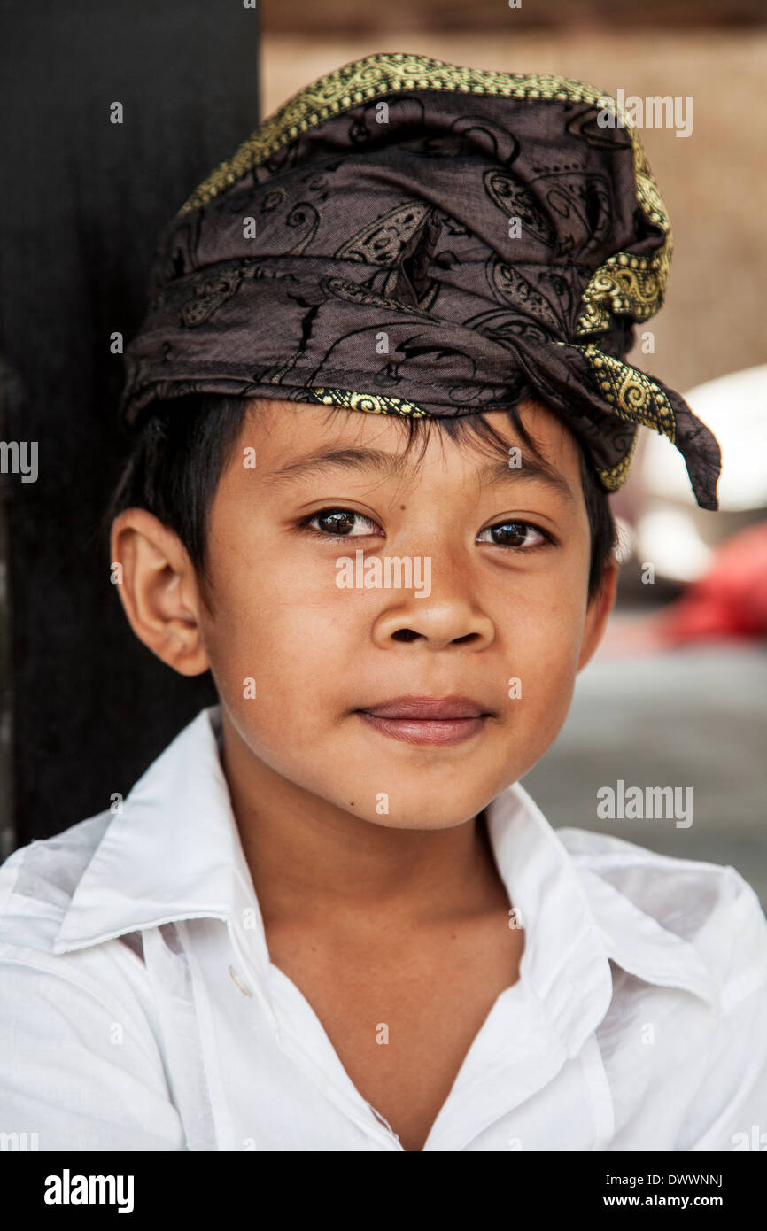Portrait of a Balinese boy dressed for a religious ceremony Stock Photo