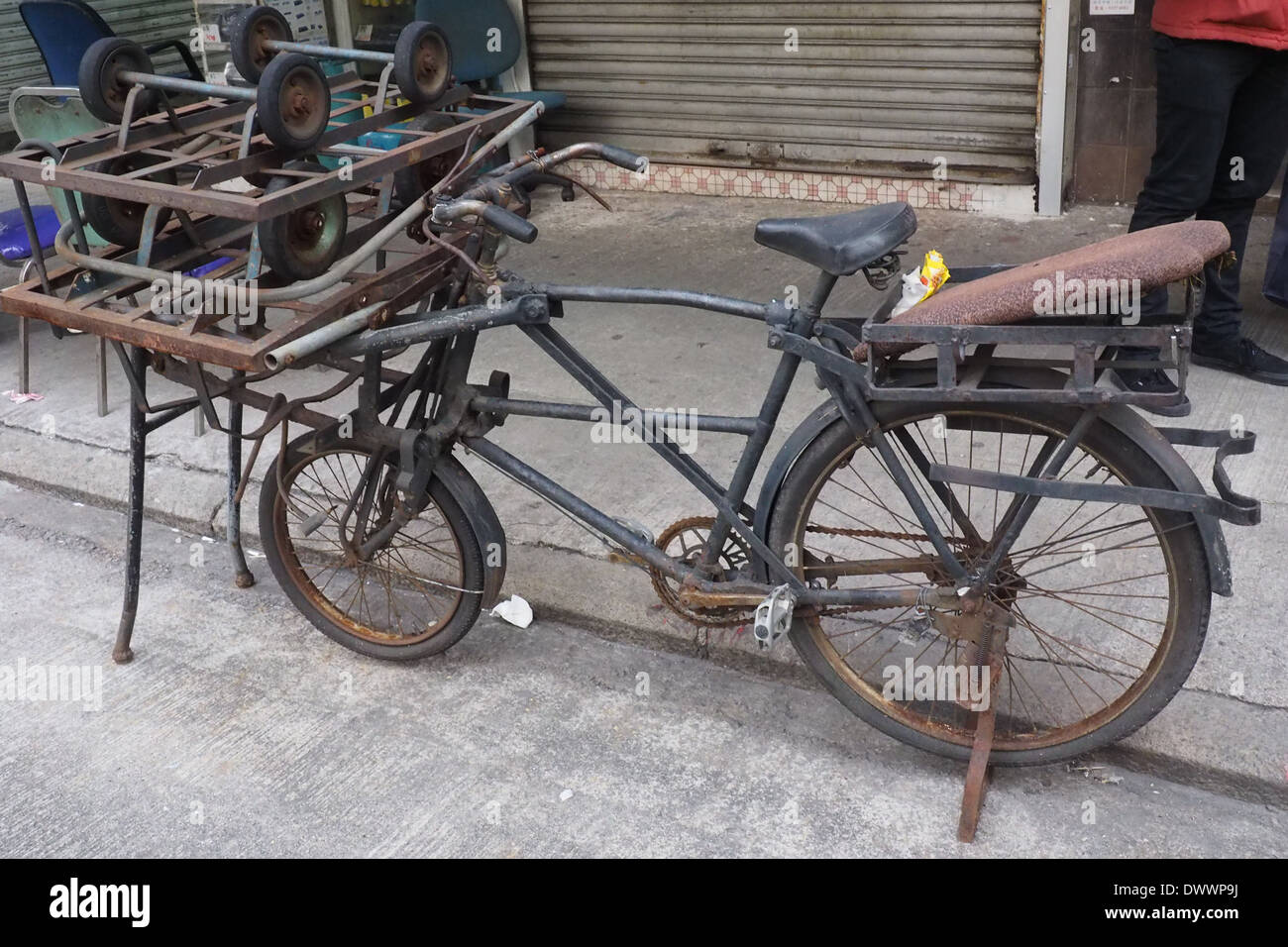 Old working bicycle with large carrier. Stock Photo