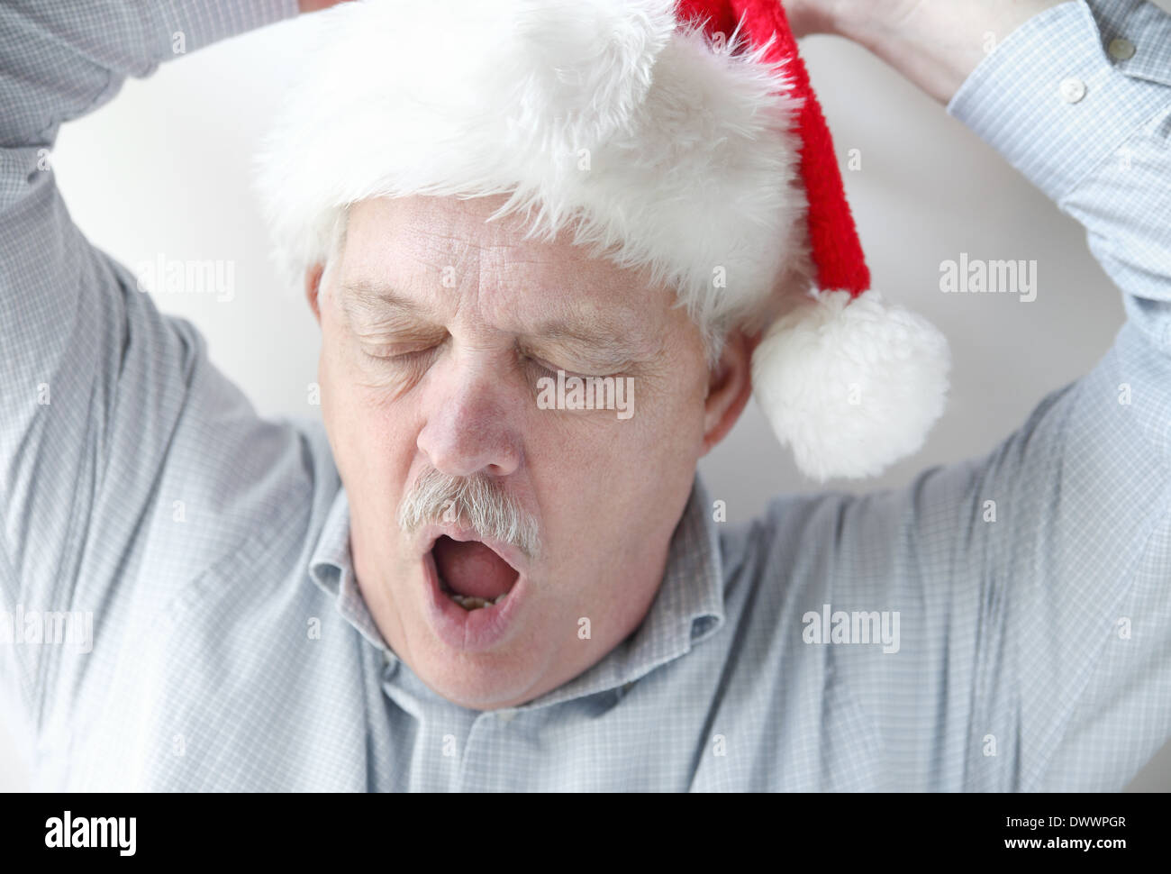 Sleepy Older Man Stretching And Yawning Stock Photo Alamy