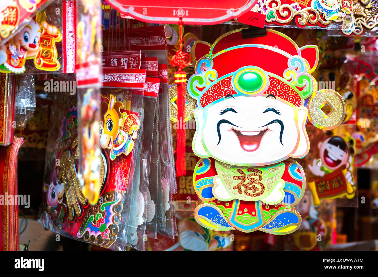 Chinese God of Wealth Cai Shen, hanging at a Hong Kong market stall Stock Photo