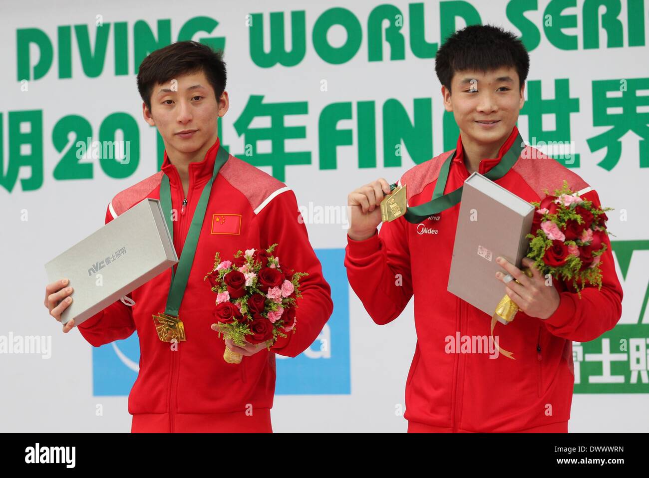 Beijing, China. 14th Mar, 2014. Lin Yue (L)/Cao Yuan display their ...