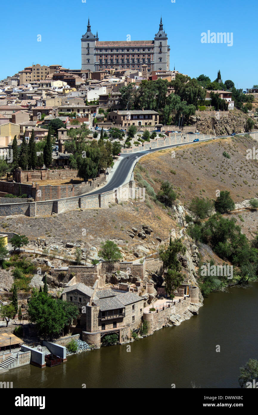 The city of Toledo in the La Mancha region of central Spain. View of the city and the Alcazar from over the River Targus. Stock Photo