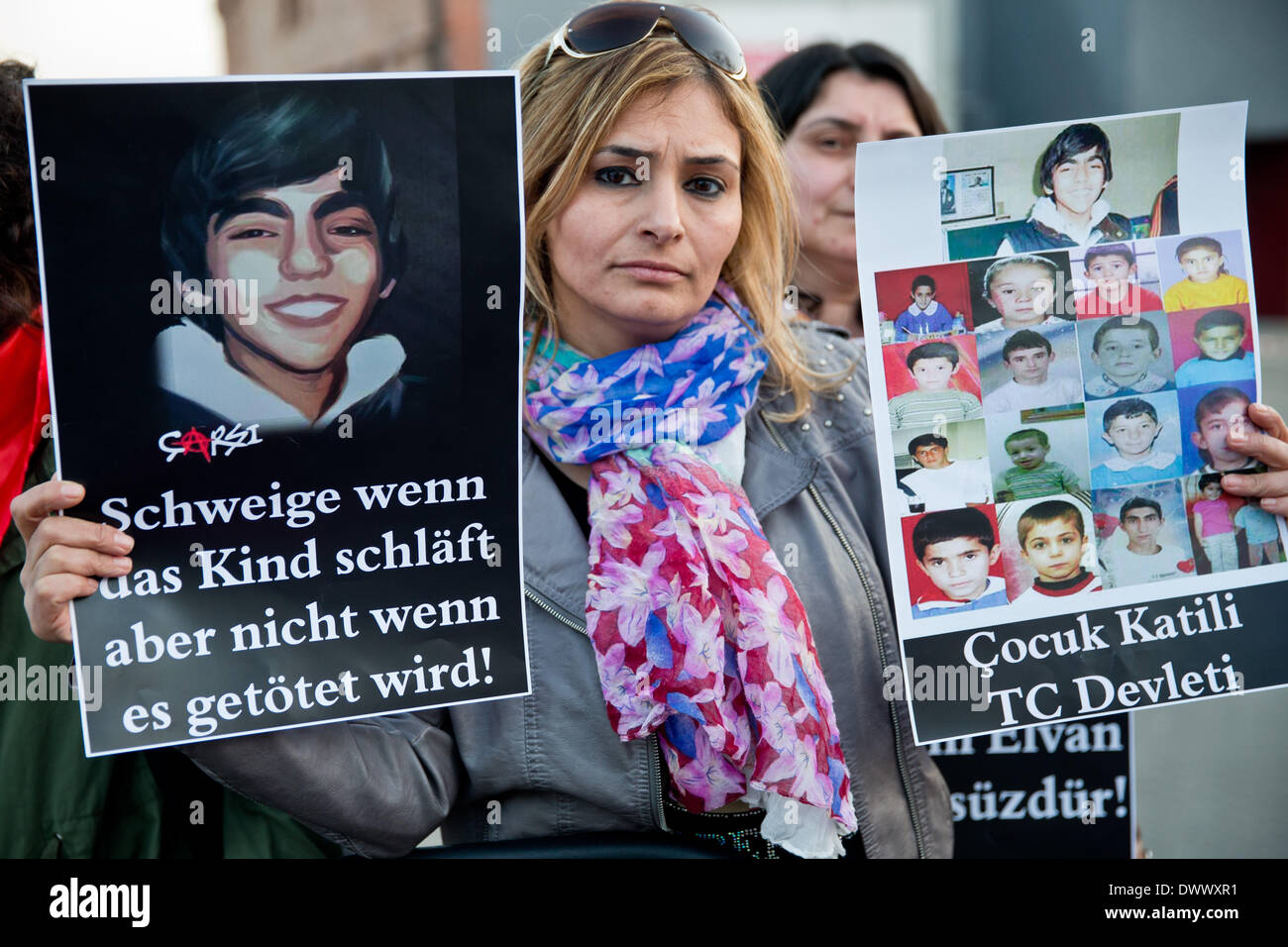 Nuremberg, Germany. 13th Mar, 2014. 'Schweige wenn das Kind schläft aber nicht wenn es getoetet wird' (lit. be quiet when a child is sleeping, not when he is being killed) is written on a poster during a protest in memory of the Berkin Elvan outside of the German-Turkish Film Festival in Nuremberg, Germany, 13 March 2014. The 15 year old was hit in the head by a police tear-gas canister during a demonstration against the Islamic conservative government in Istanbul. He died after spending 269 days in a coma. Photo: Daniel Karmann/dpa/Alamy Live News Stock Photo