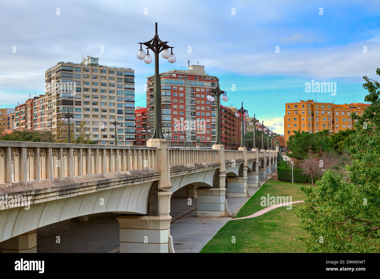 Bridge across old river bed of Turia towards contemporary residential buildings in Valencia, Spain. Stock Photo