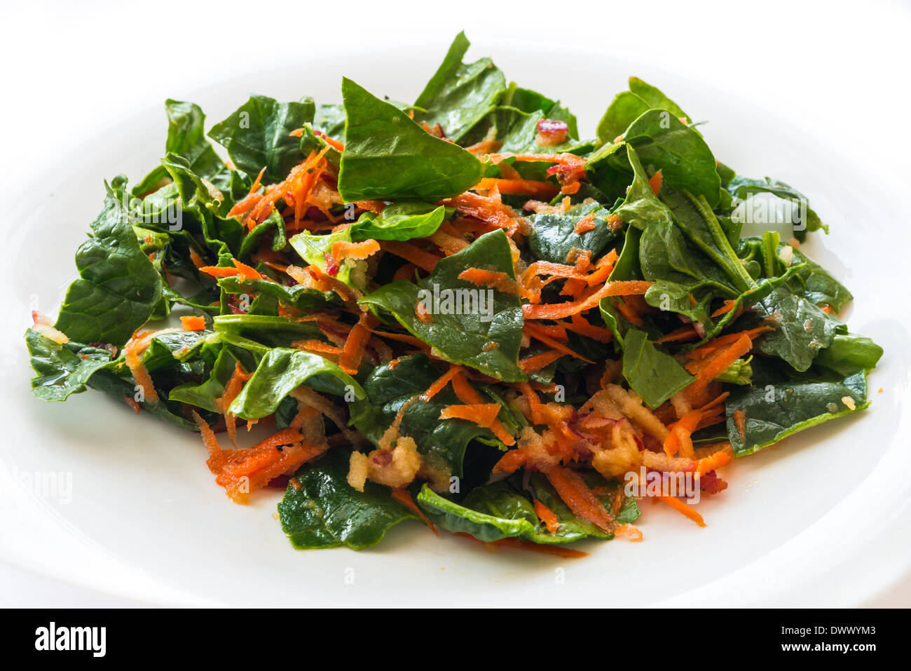 Mix vegetables salad with carrot, spinach and apple Stock Photo