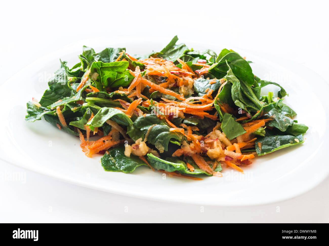 Mix vegetables salad with carrot, spinach and apple Stock Photo