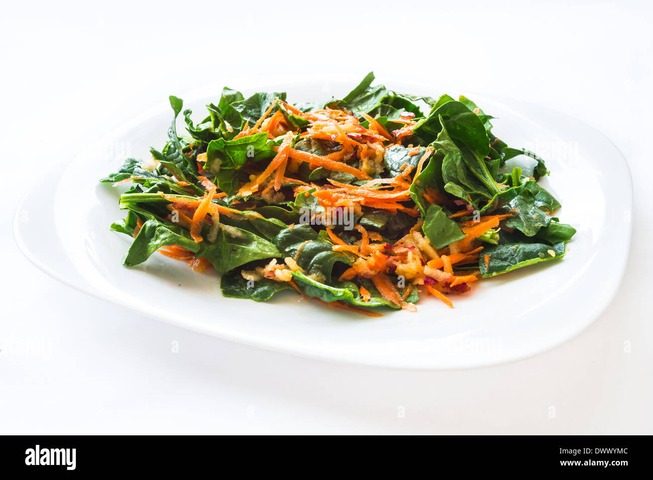 Mix vegetables salad with carrot, spinach and apple Stock Photo