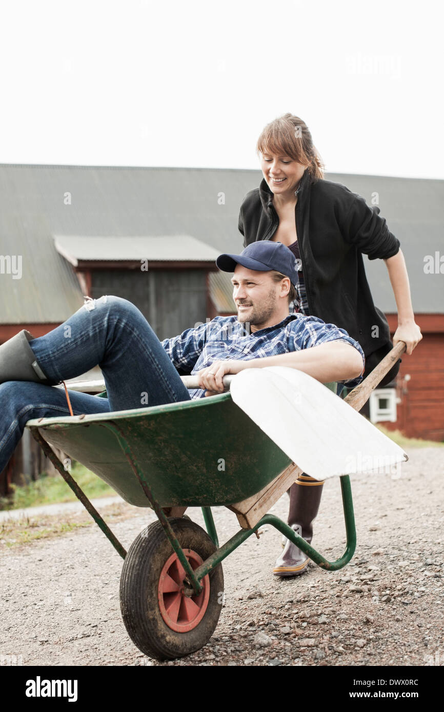 He Is Sitting In The Wheelbarrow High Resolution Stock Photography and