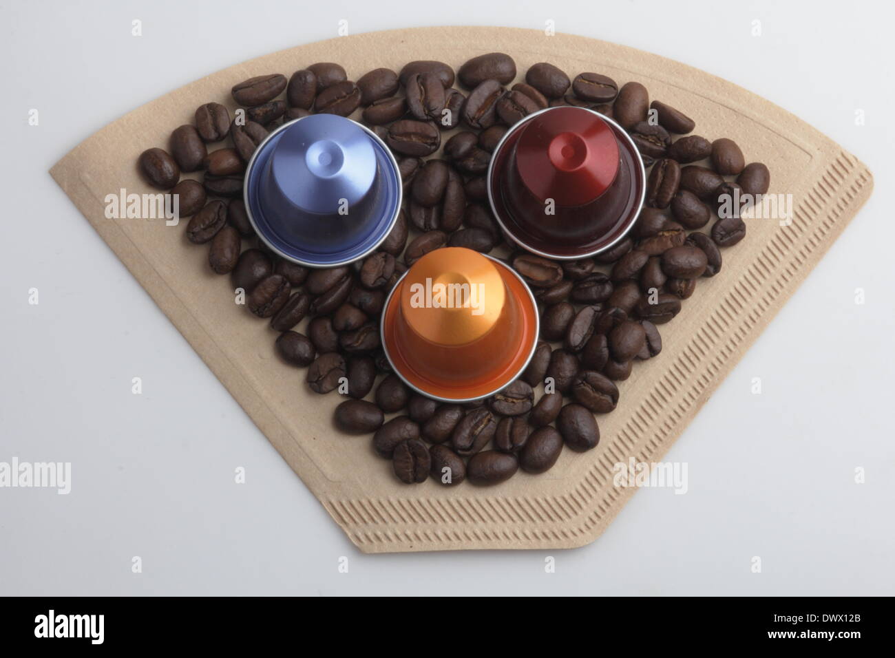 various coffee capsules, coffee beans and a filter paper Pictured 21.01.2014 Stock Photo