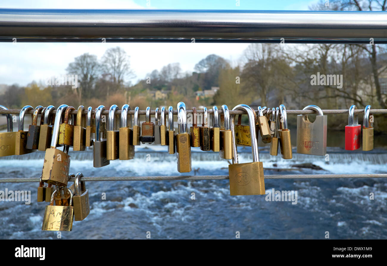 love padlocks attached to the bridge over the river wye Bakewell Derbyshire england uk Stock