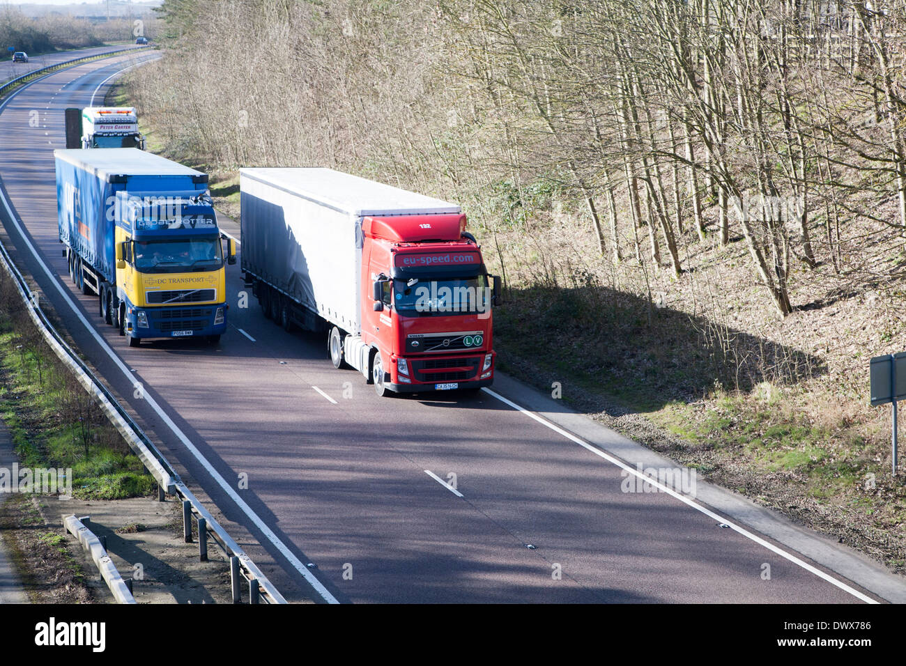 Volvo heavy goods vehicles on A12 trunk road in Suffolk, England Stock Photo
