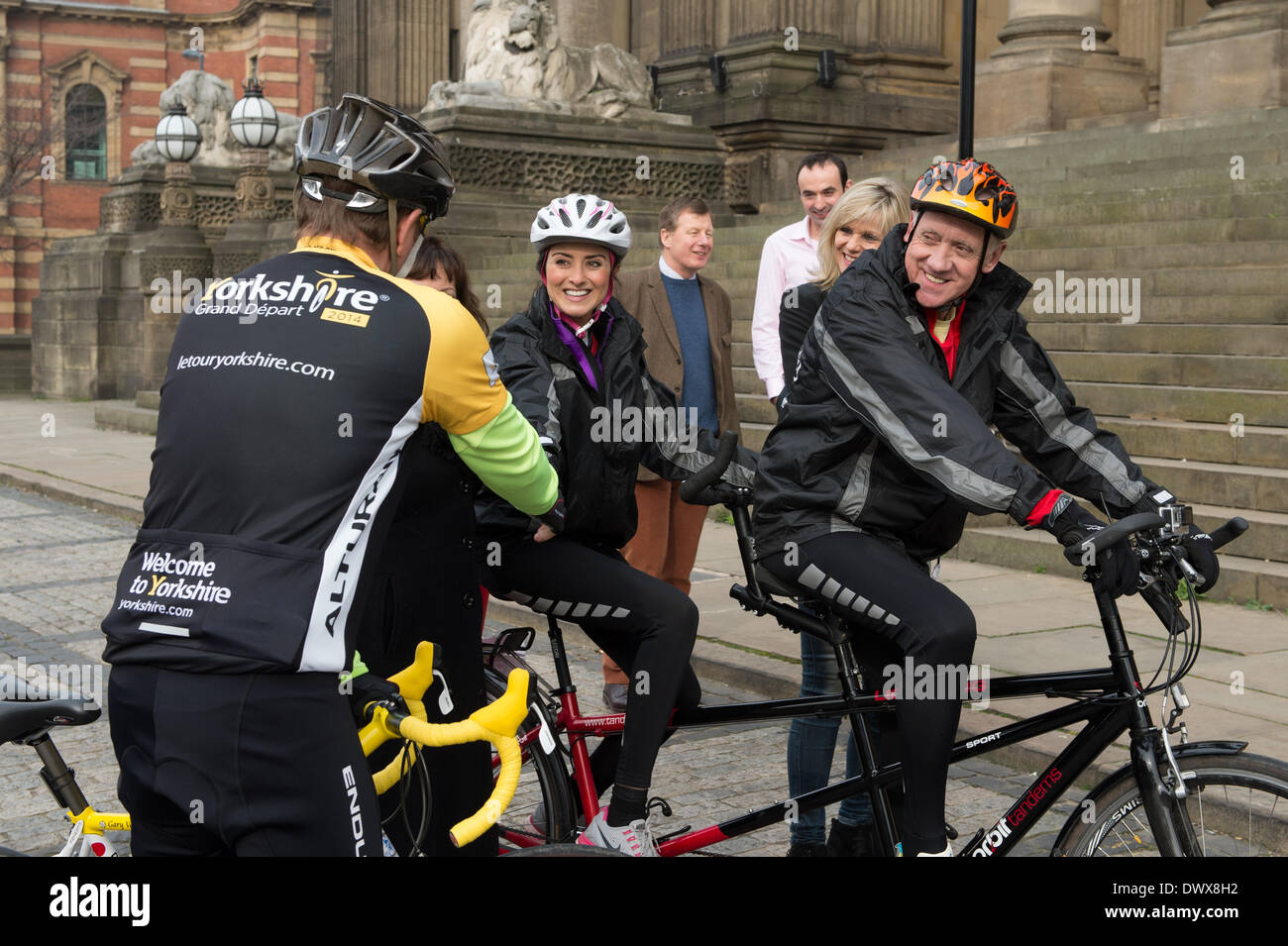 Look North's Harry & Amy's Tandem Tour de Yorkshire in aid of Sport Relief - Harry & Amy on their bike before the start, smiling, laughing & chatting to Kay Mellor & Gary Verity - Leeds Town Hall, West Yorkshire, England, UK. Stock Photo