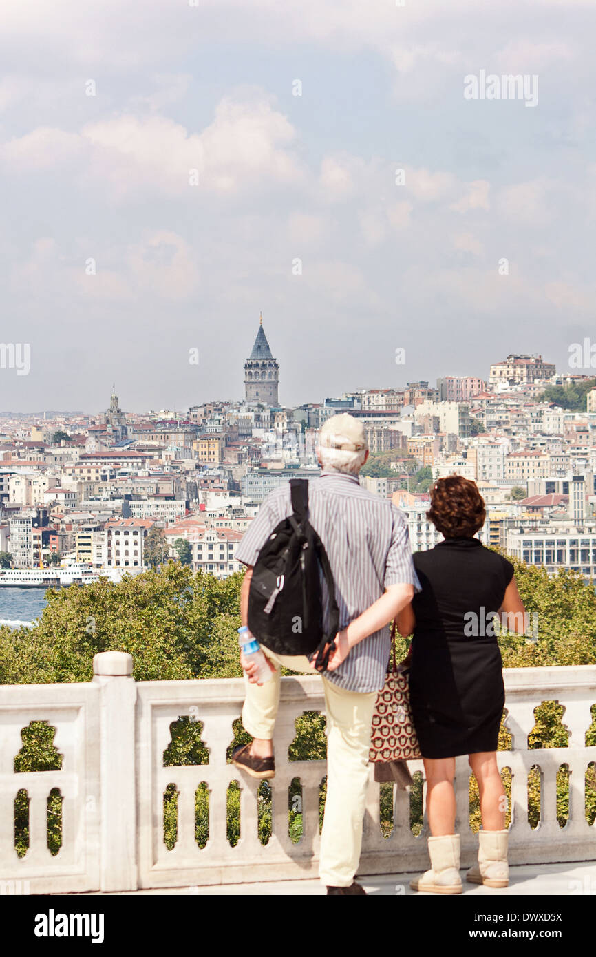 Couple of senior people looking at Galata tower from Topkapi palace Stock Photo