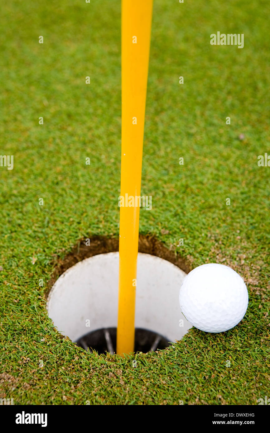 Golf Ball Hole Stock Photo Alamy