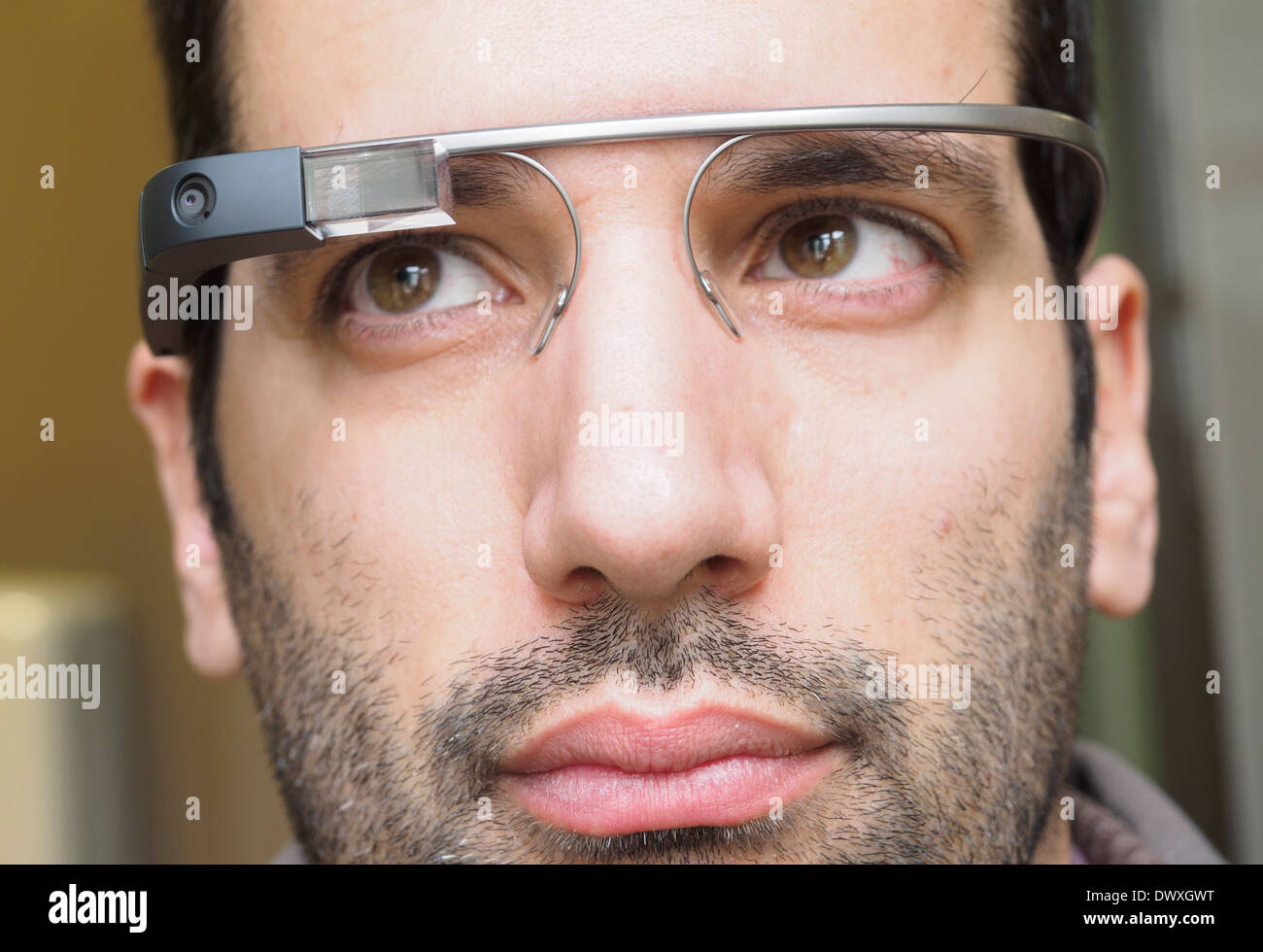Close up portrait of young man wearing Google Glass Stock Photo