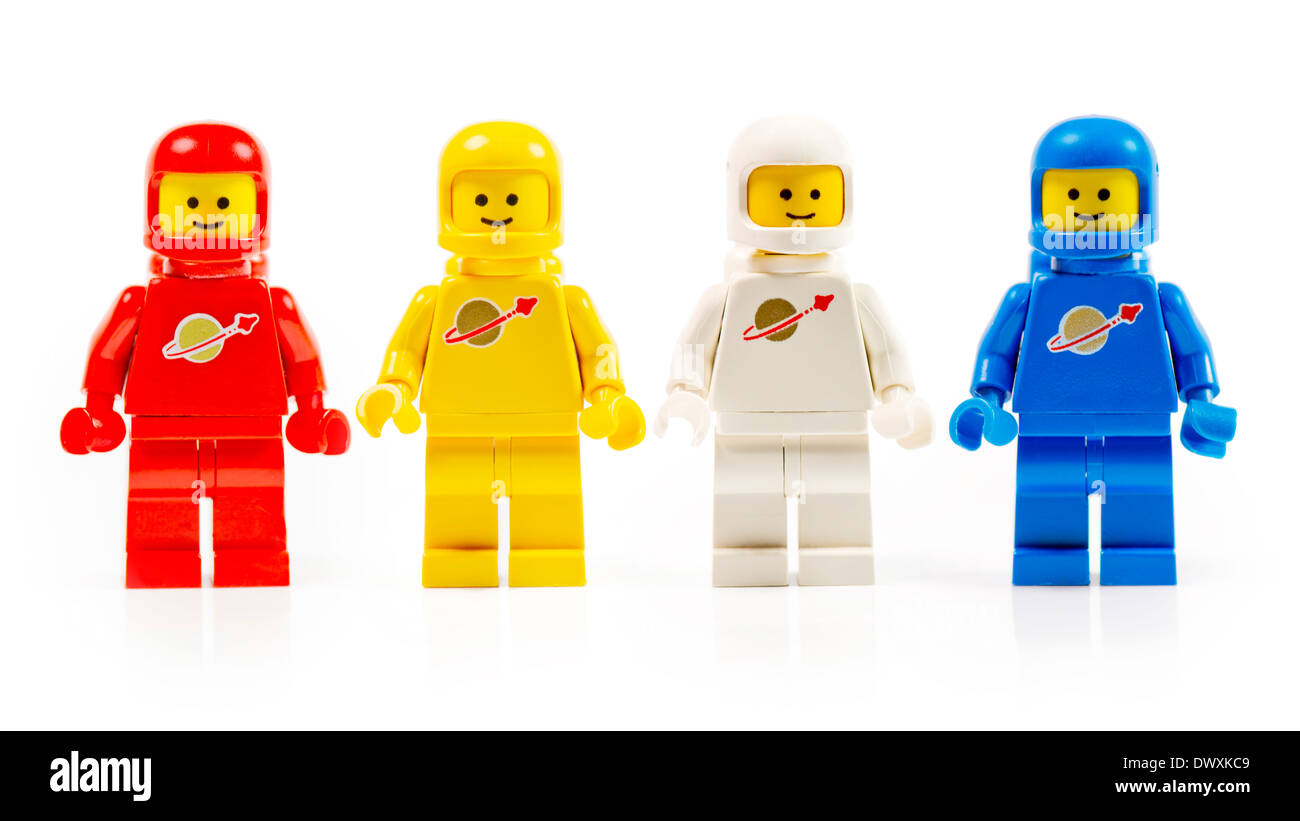 A group of four various astronaut lego mini characters from the 80s isolated on white. Stock Photo