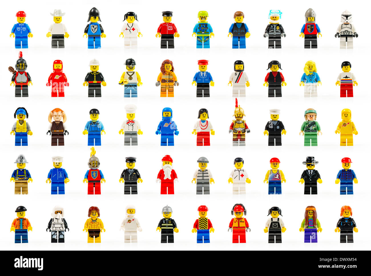 A group of fifty various lego mini figures of the past and present on white background. Stock Photo