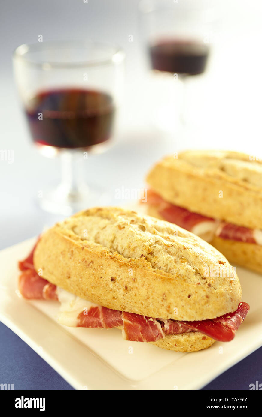 Iberian ham tapas with cup of wine for two. Stock Photo