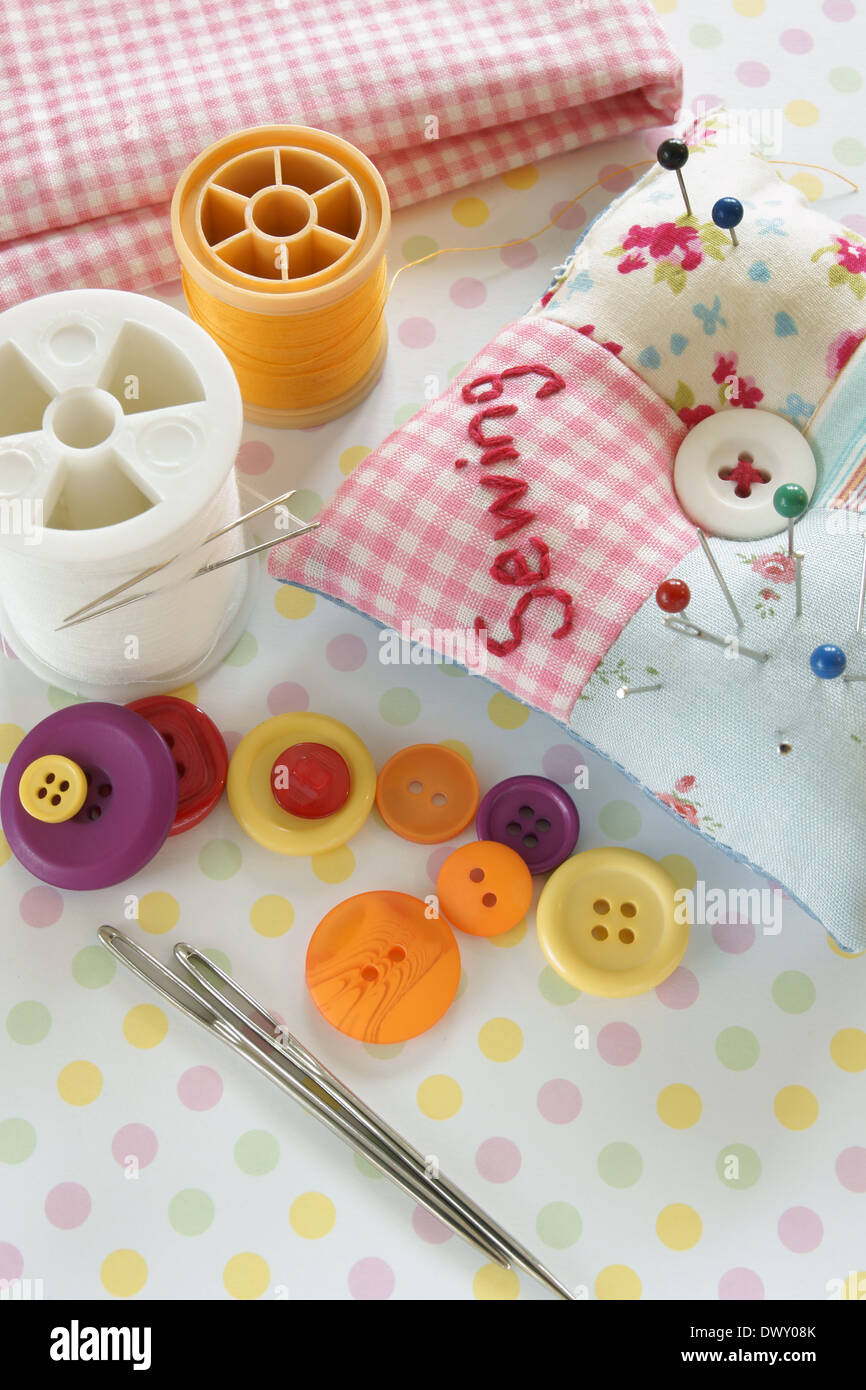 Needles and threads with a pin cushion Stock Photo Alamy