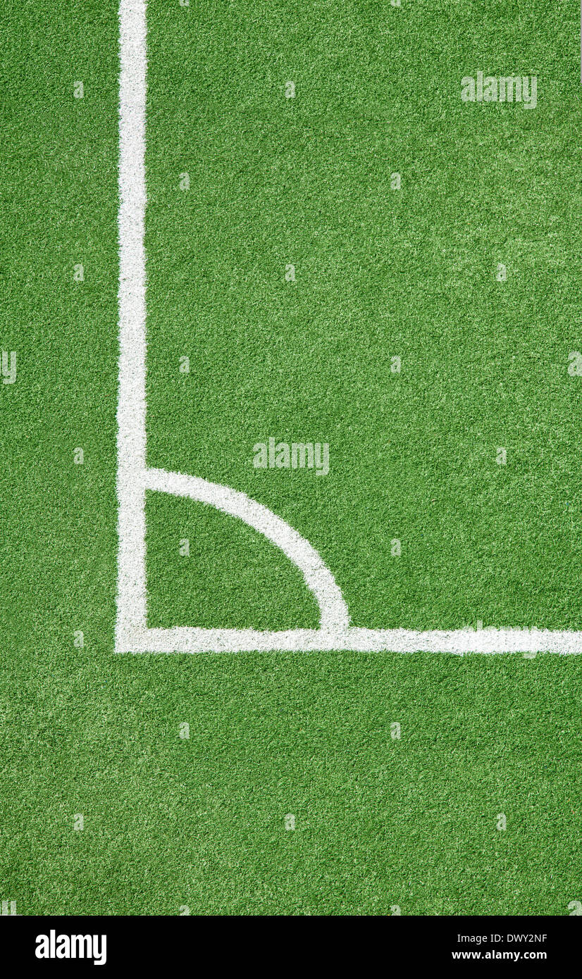 Soccer field. White corner line against green field Stock Photo