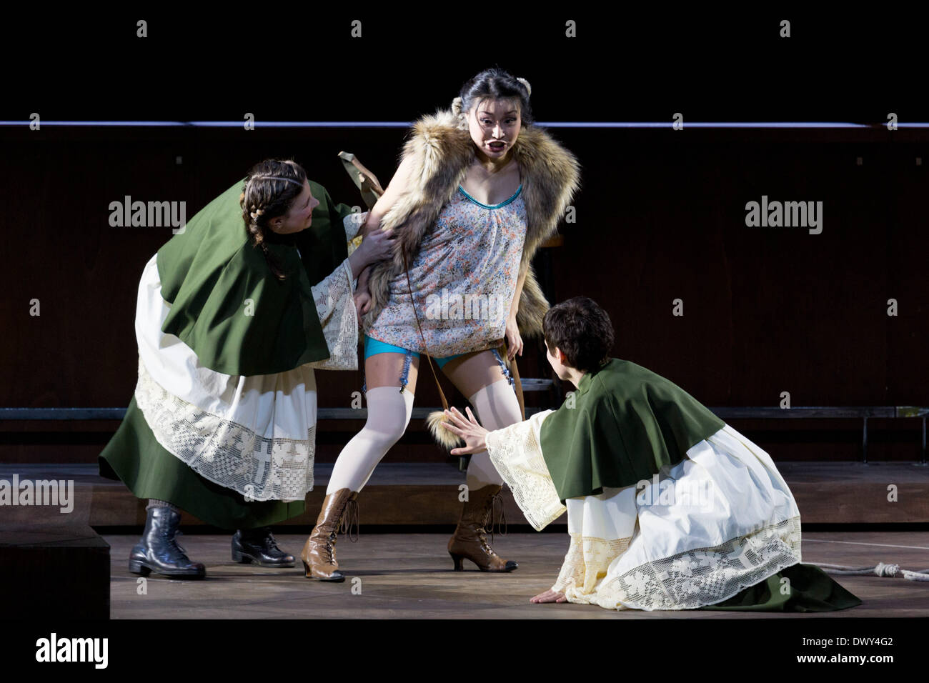 Leos Janacéks opera 'the cunning little Vixen' was staged at the Hamburg state-opera on 9 March 2014. with Hayoung Lee (vixen), Lauri Vasar (forester) and Levente Páll (poacher). the opera was cinducted by Sir Lawrence Foster Image taken 5 March 2014. Stock Photo