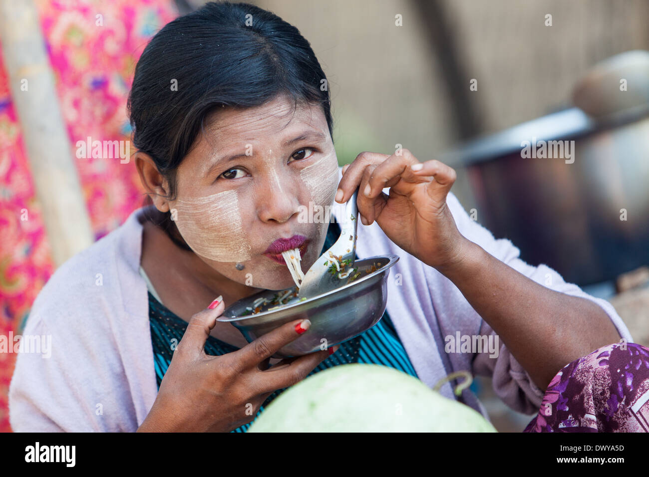 Myanmar lady eating noodle soup Stock Photo