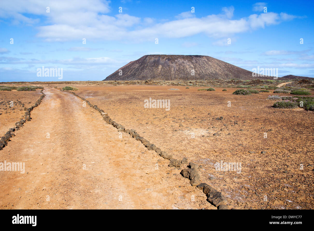 Trail and volcano on Los Lobos island, near Fuerteventura, in the Canary Islands, Spain. Stock Photo