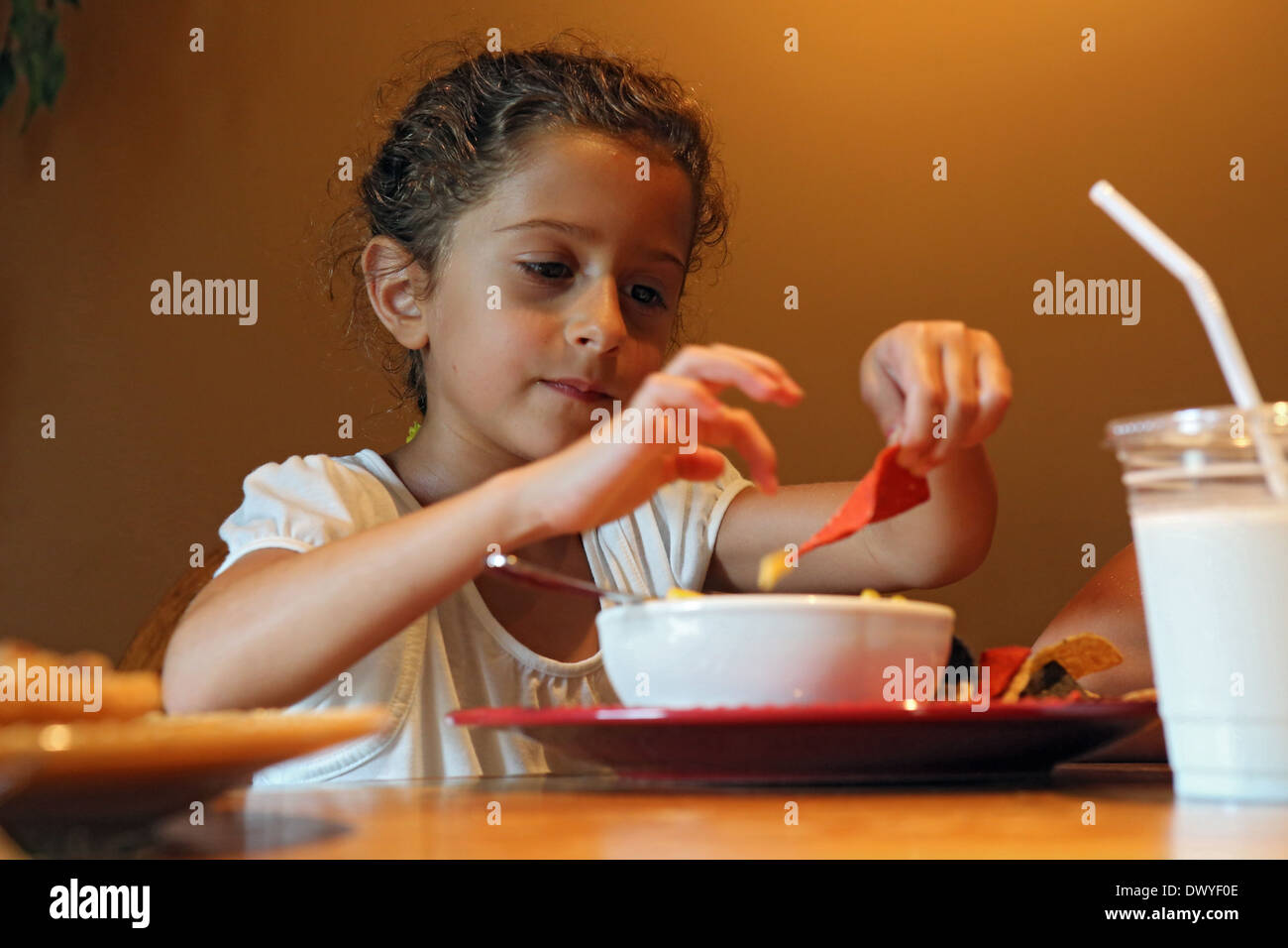Child eating tortilla chip hires stock photography and images Alamy