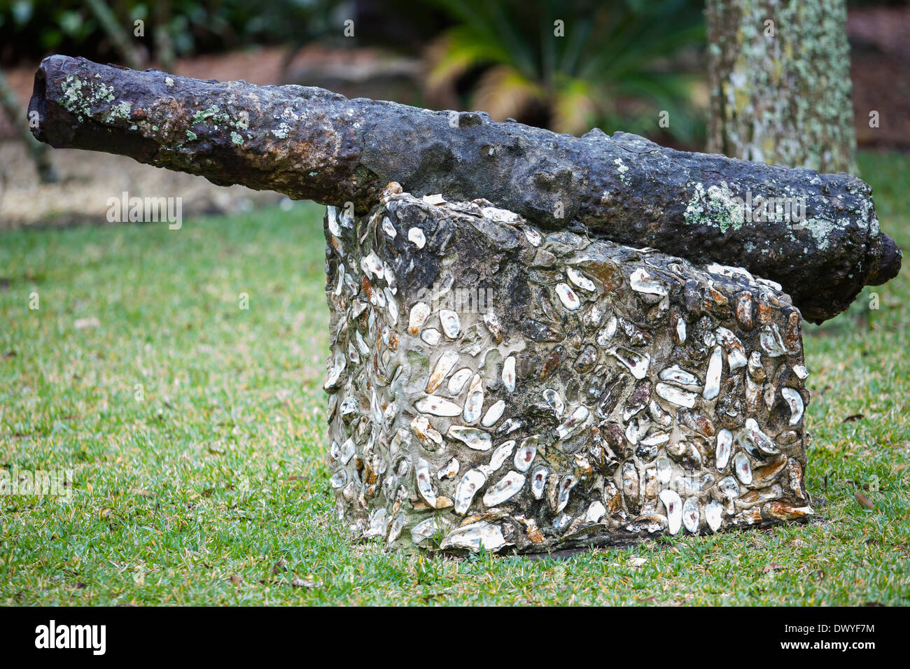 A gun salvaged from a shipwreck sits on a coquina stone stand in St. Augustine Fountain of Youth Archaeological Park Stock Photo