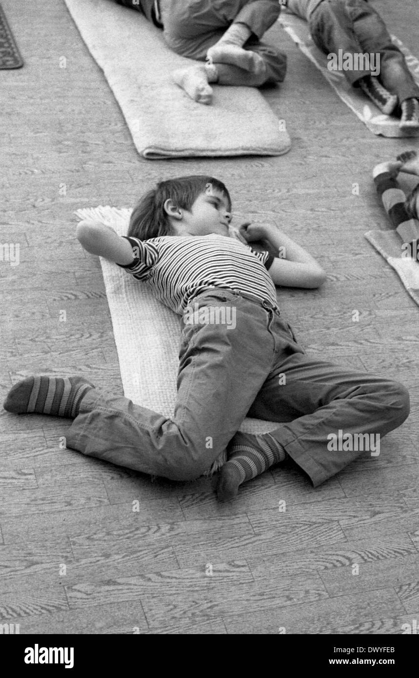 Berlin, GDR, boy doing yoga in a kindergarten Stock Photo