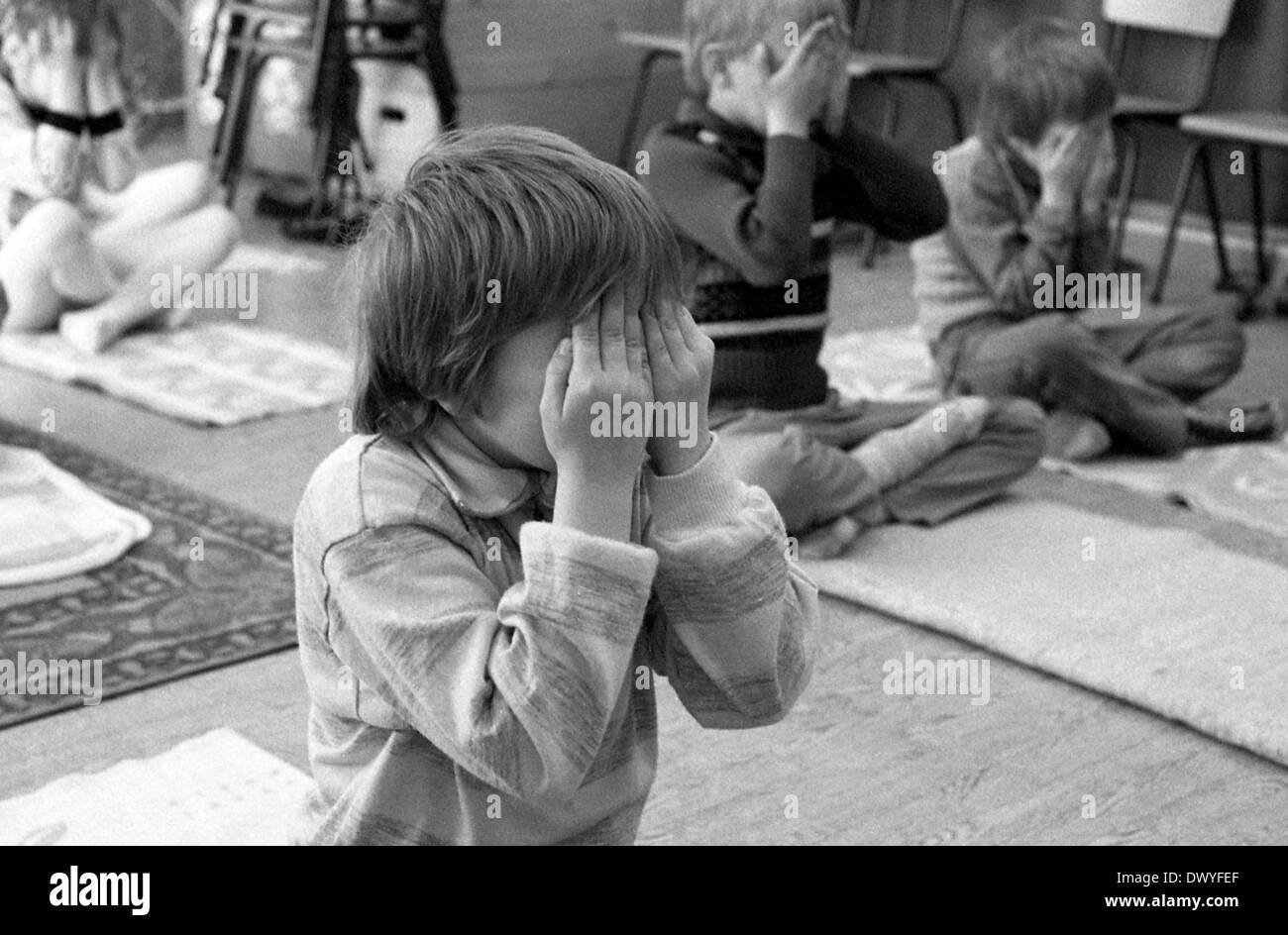 Berlin, GDR, small children keep their eyes on Stock Photo