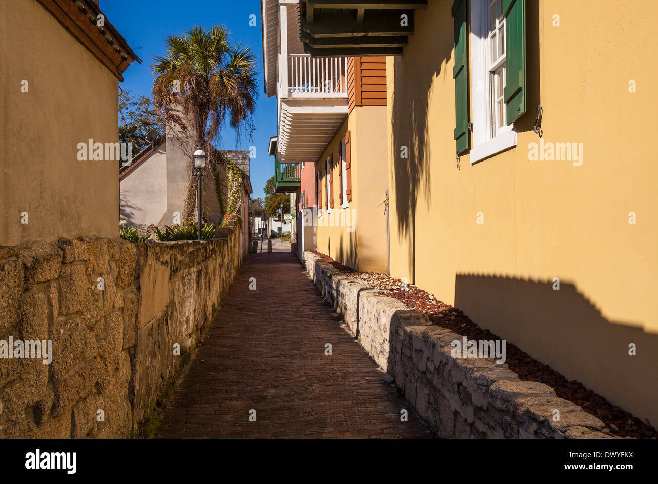 A narrow paved street is pictured in St. Augustine historical district, Florida Stock Photo