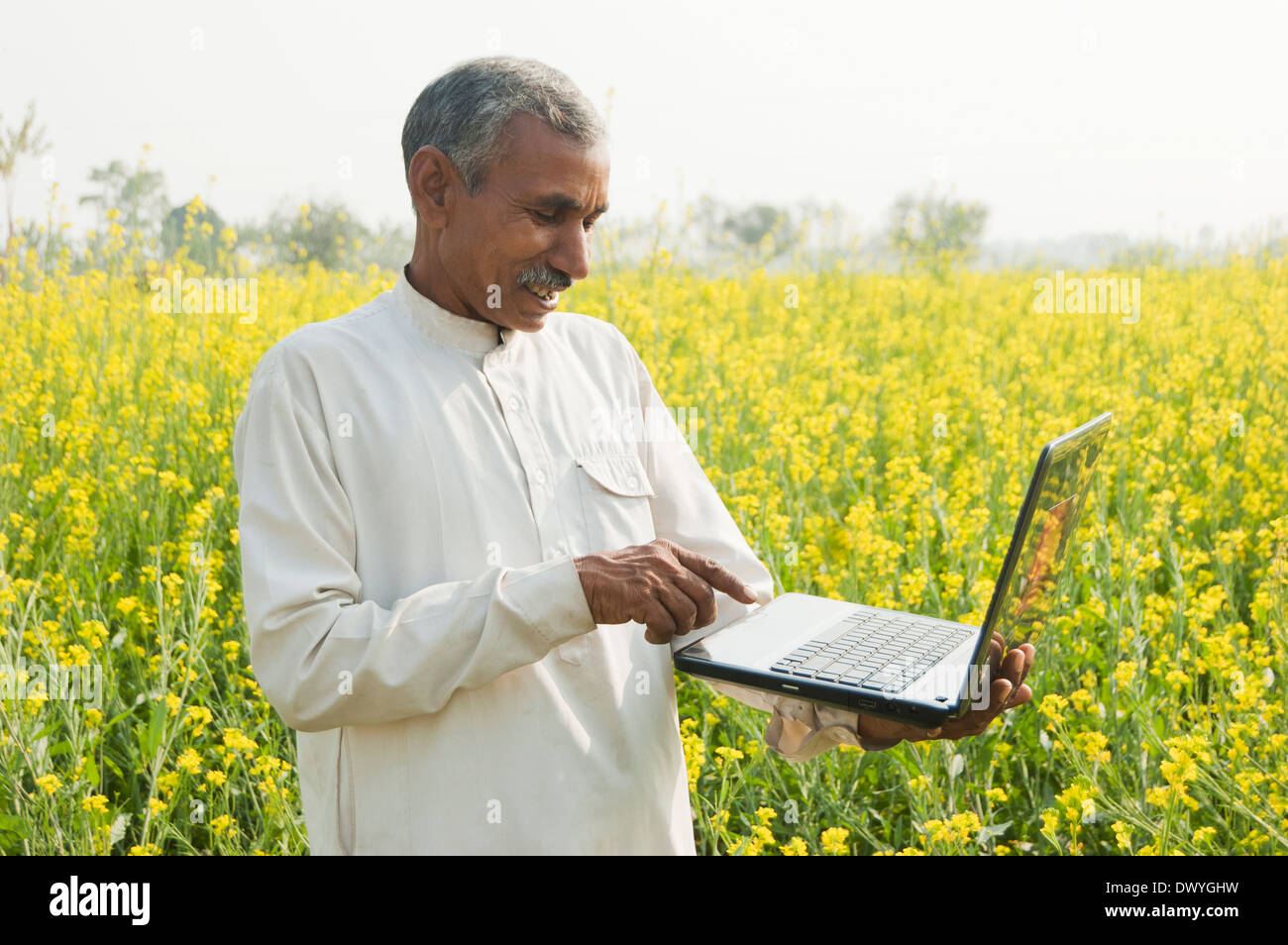 1 Indian Farmer Standing in Farm With Laptop Stock Photo - Alamy