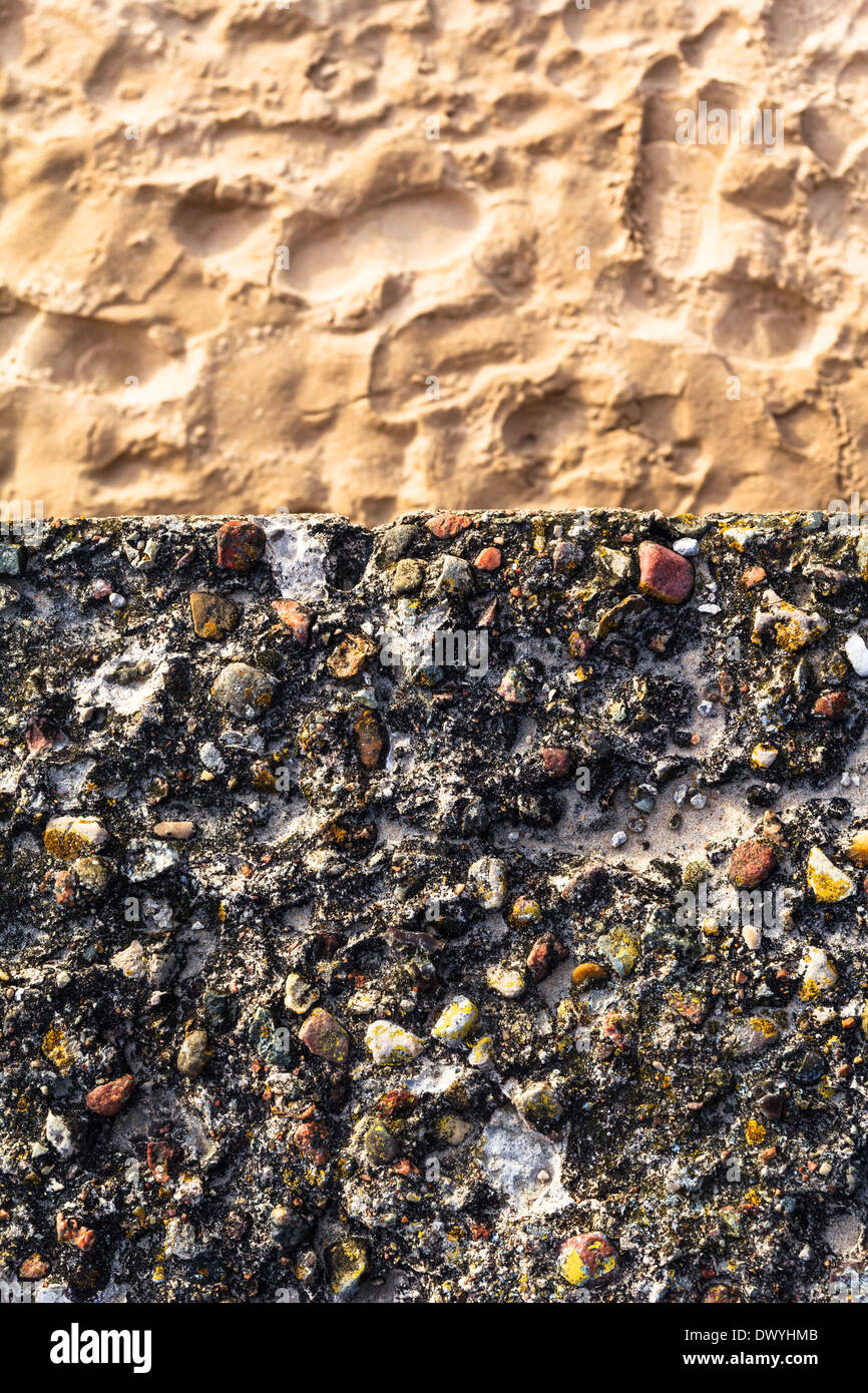 Picture of Concrete wall with colorful pebbles and sand Stock Photo - Alamy