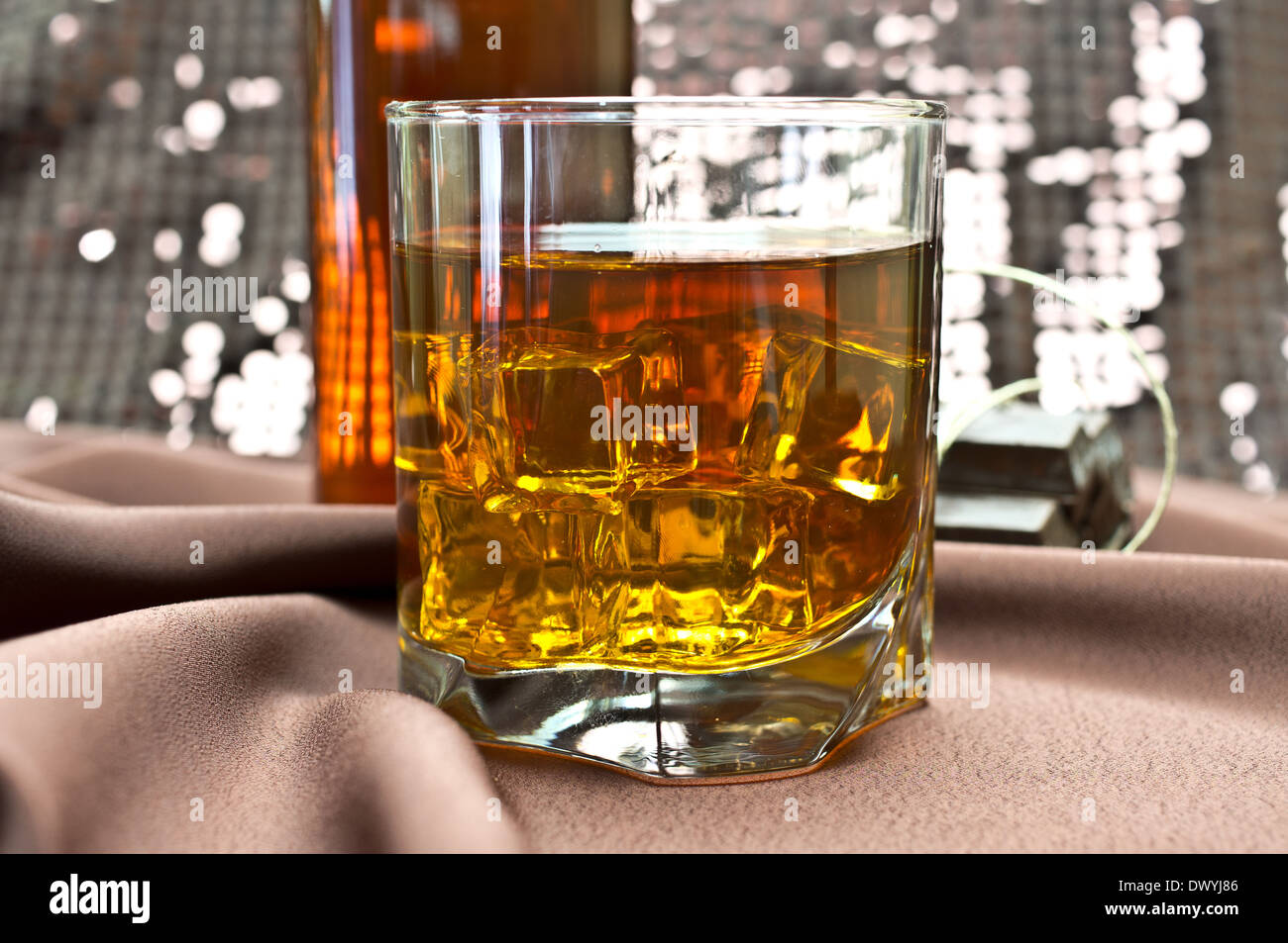whiskey in the glass, chocolates, a bottle Stock Photo
