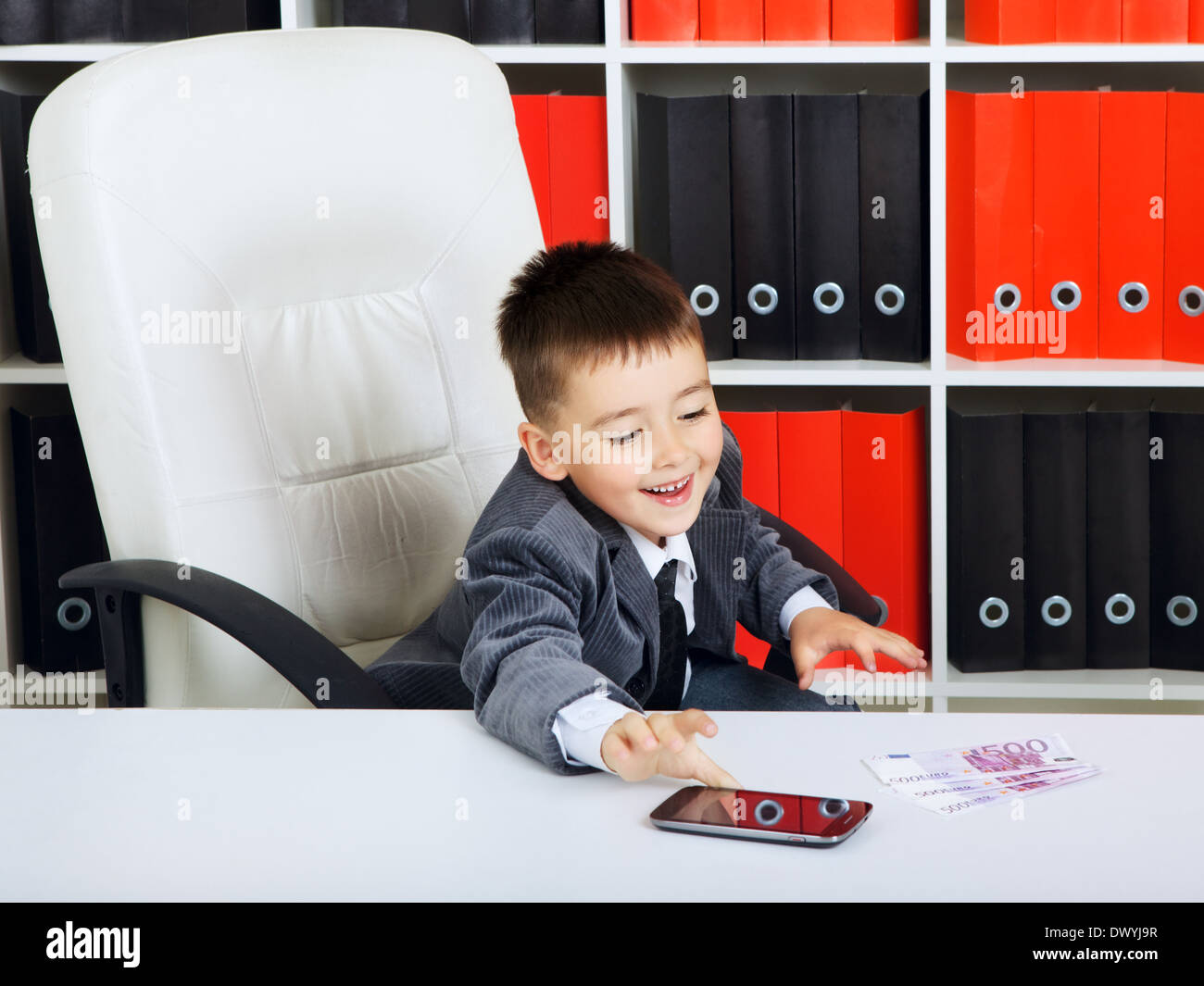 little boy as a businessman, in office Stock Photo - Alamy