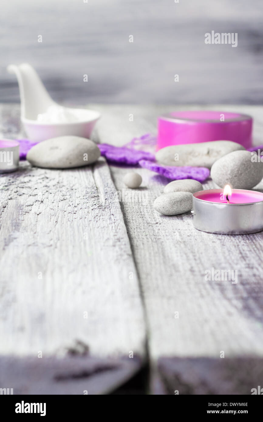 Zen stones and aromatic candles on wooden background Stock Photo