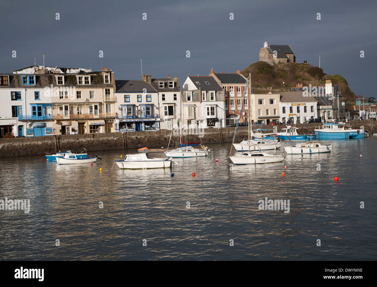View of boats in the harbour in sunshine of winter afternoon, Ilfracombe, north Devon, England Stock Photo
