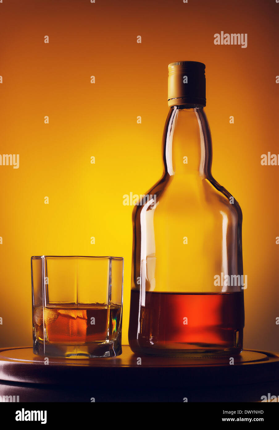 Download Glass And Bottle Of Whiskey On A Yellow Background Stock Photo Alamy Yellowimages Mockups