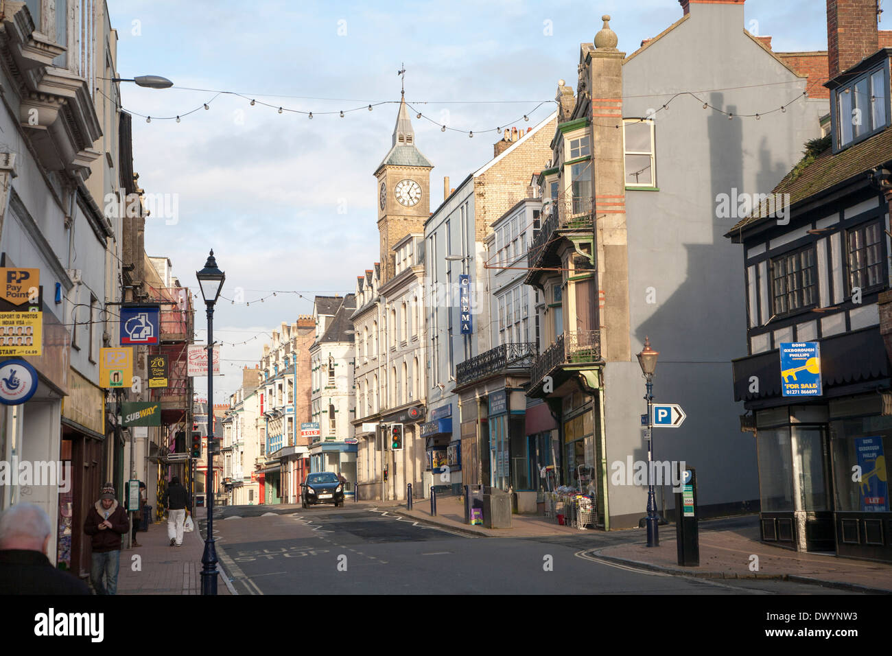 View of the main shopping street, High Street, Ilfracombe in winter evening light, north Devon, England Stock Photo