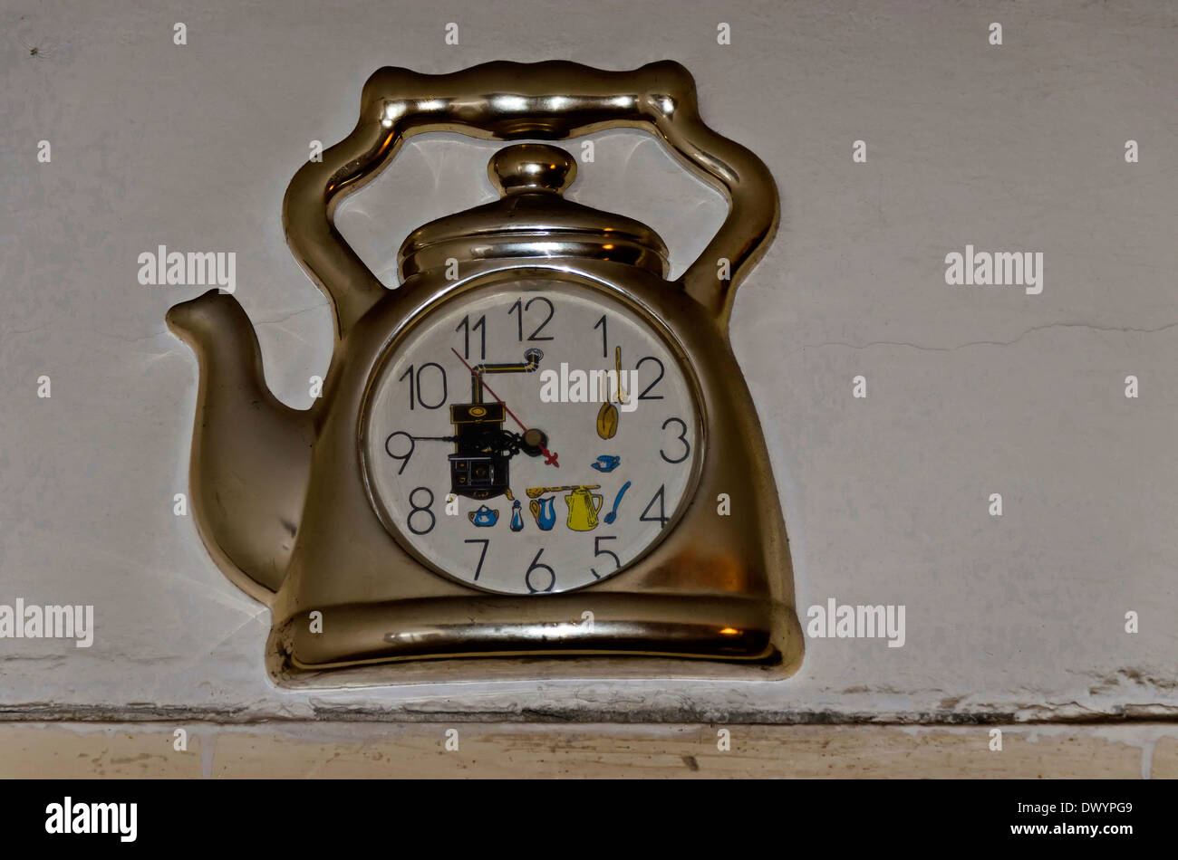 Old clock mounting in the frame of kettle Stock Photo